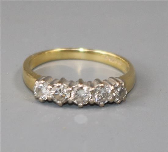 A modern 18ct gold and five stone diamond ring, size I.